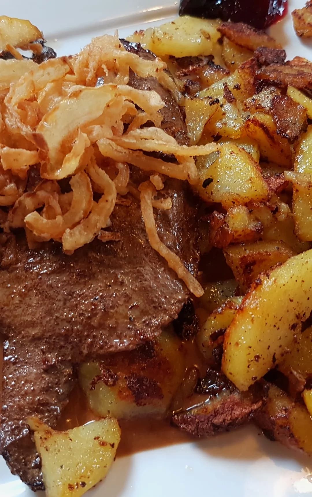 Liver and onions with fried potatoes